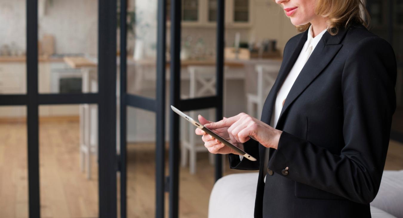 Woman checking alarm system